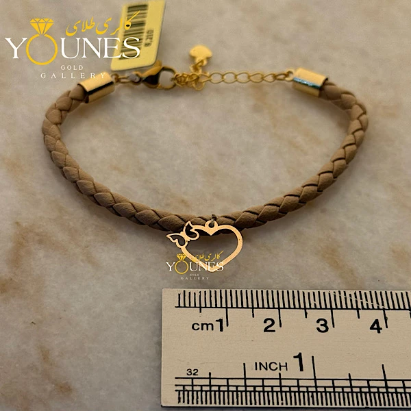 دستبند چرم کرمی پروانه قلبی طلا